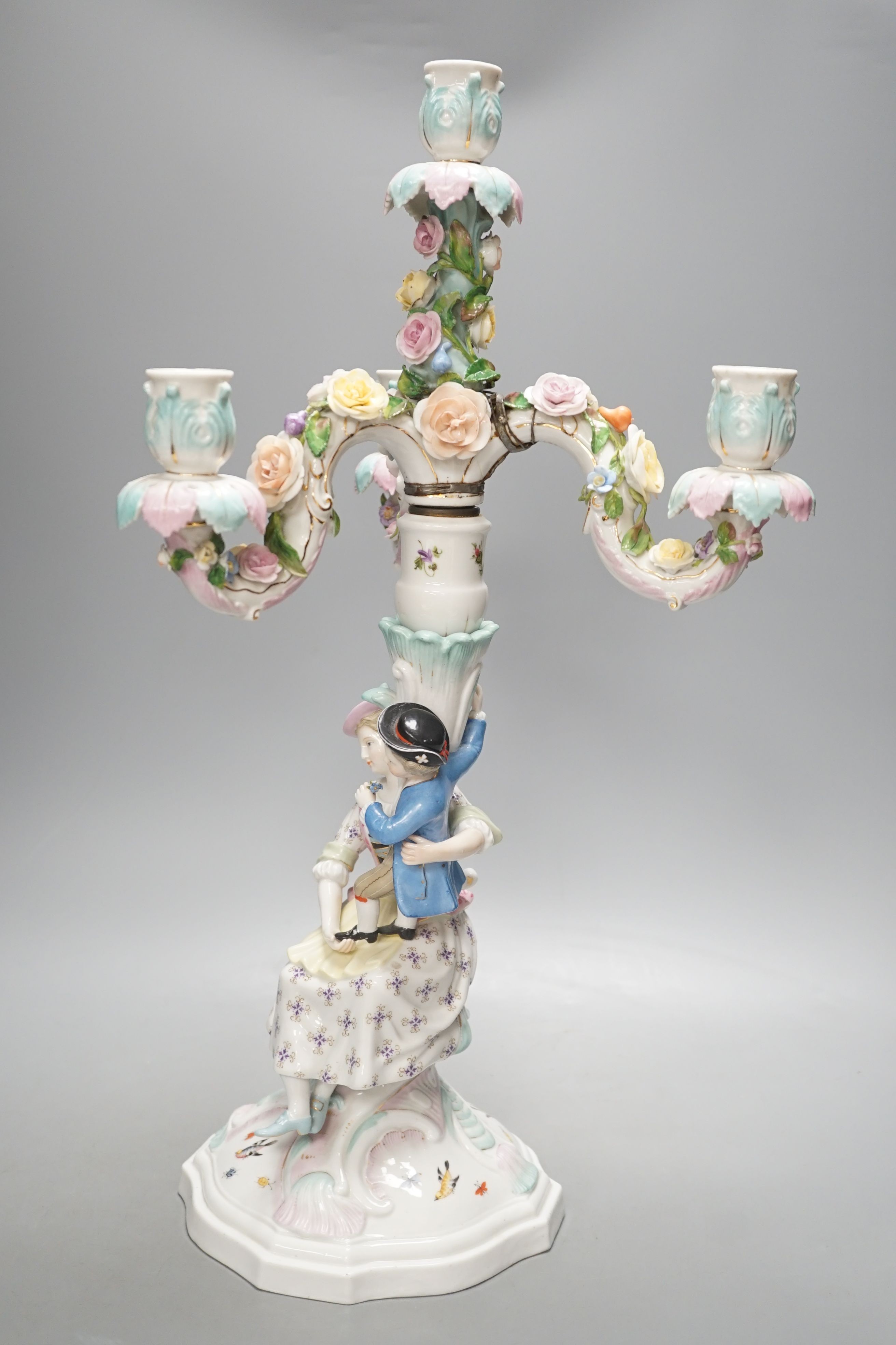 A Sitzendorf three branch candelabrum, 51.5 cms high.